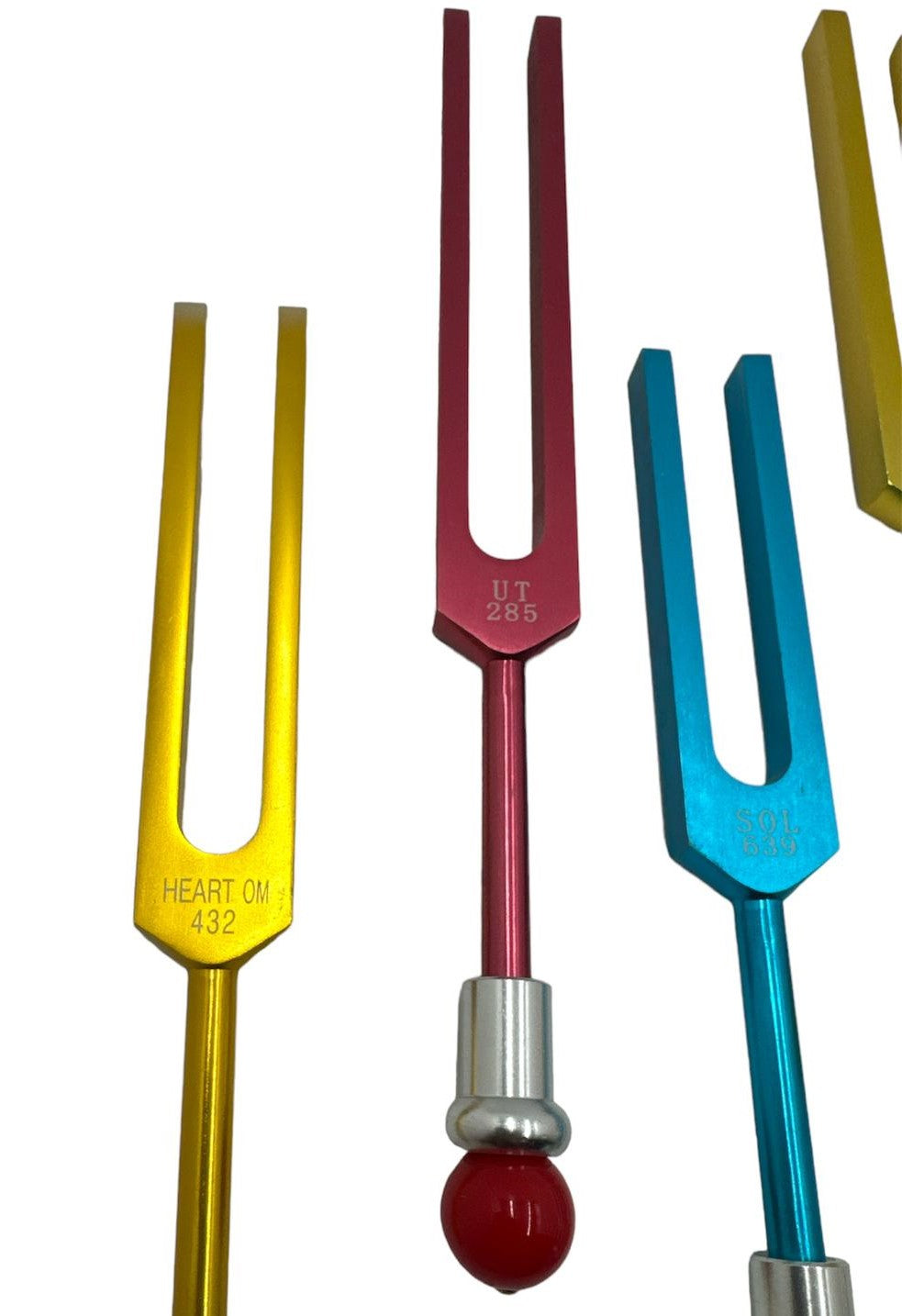 9 Secret Solfeggio Unweighted Color Tuning Forks Set with Heart Om tuning fork, Individually Marked Bags, Striker with Removable Buddha Bead - Thecosmicaccess