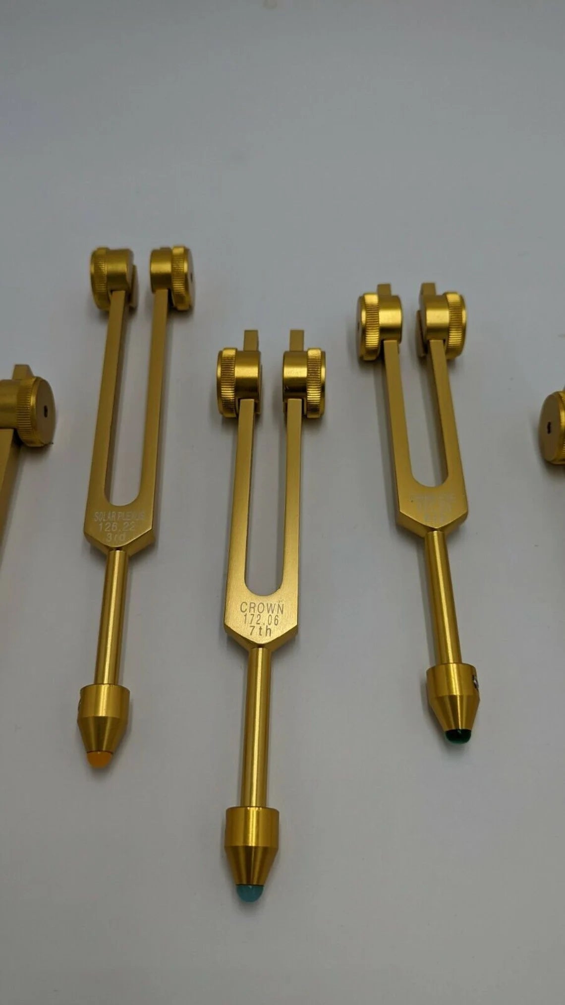 Gold Color Chakra Weighted Set of 8 with Gem Feet, Velvet Bag and Striker - Thecosmicaccess