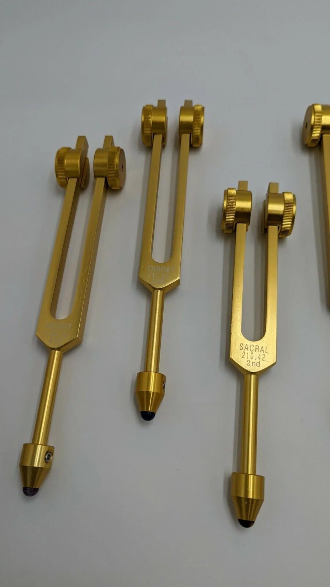 Gold Color Chakra Weighted Set of 8 with Gem Feet, Velvet Bag and Striker - Thecosmicaccess