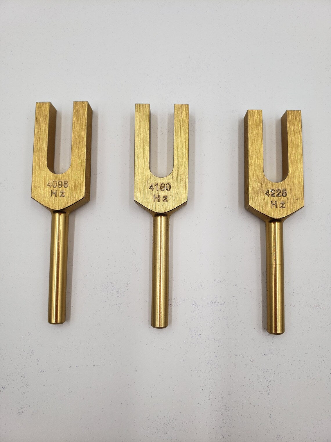 Celestial Harmony: Gold Finish Angel Tuning Fork Set for Healing Sound Therapy - Includes 4096, 4160, and 4225 Hz Tuners, Mallet, and Pouch