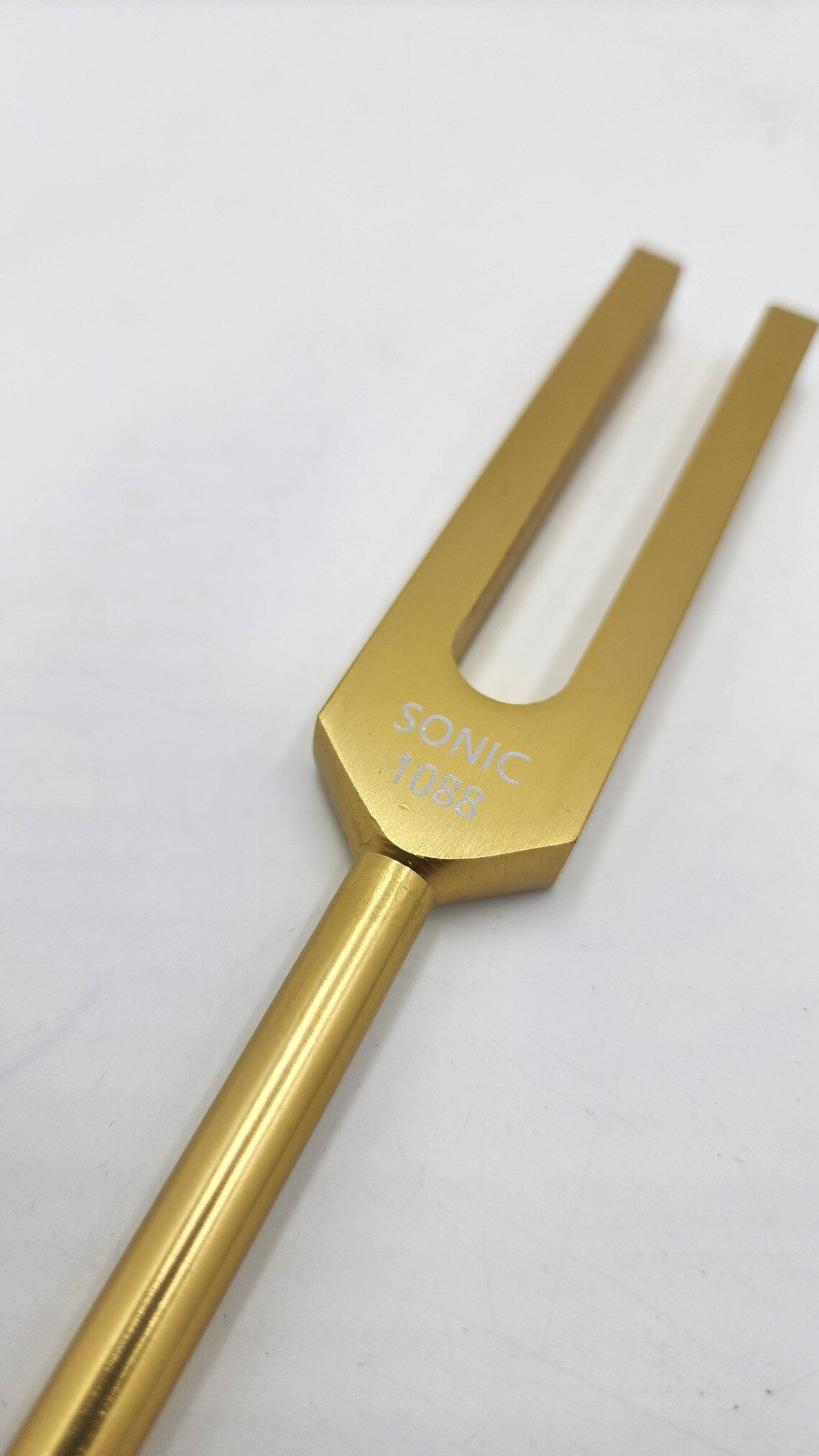 Harmonizing Energies: The Sonic Gold Color Om Tuning Fork for Crystal and Space Renewal with Striker