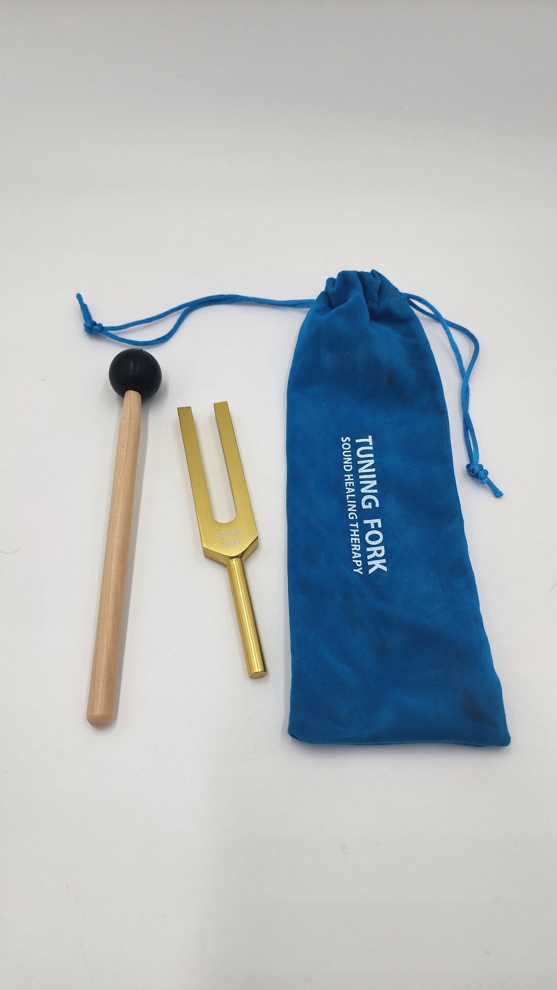 Harmonizing Energies: The Sonic Gold Color Om Tuning Fork for Crystal and Space Renewal with Striker