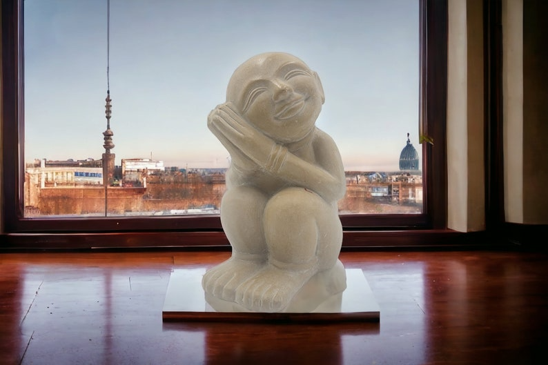 Timeless Charm: Captivating Antique Soapstone Statue of a Dreaming Child - Thecosmicaccess