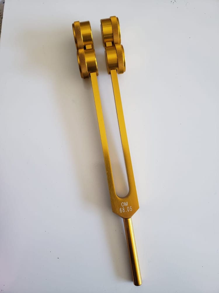 Low Om 68.05 Gold Color 9th Chakra Hz Weighted Tuning Fork with Mallet and Velvet Bag - Thecosmicaccess
