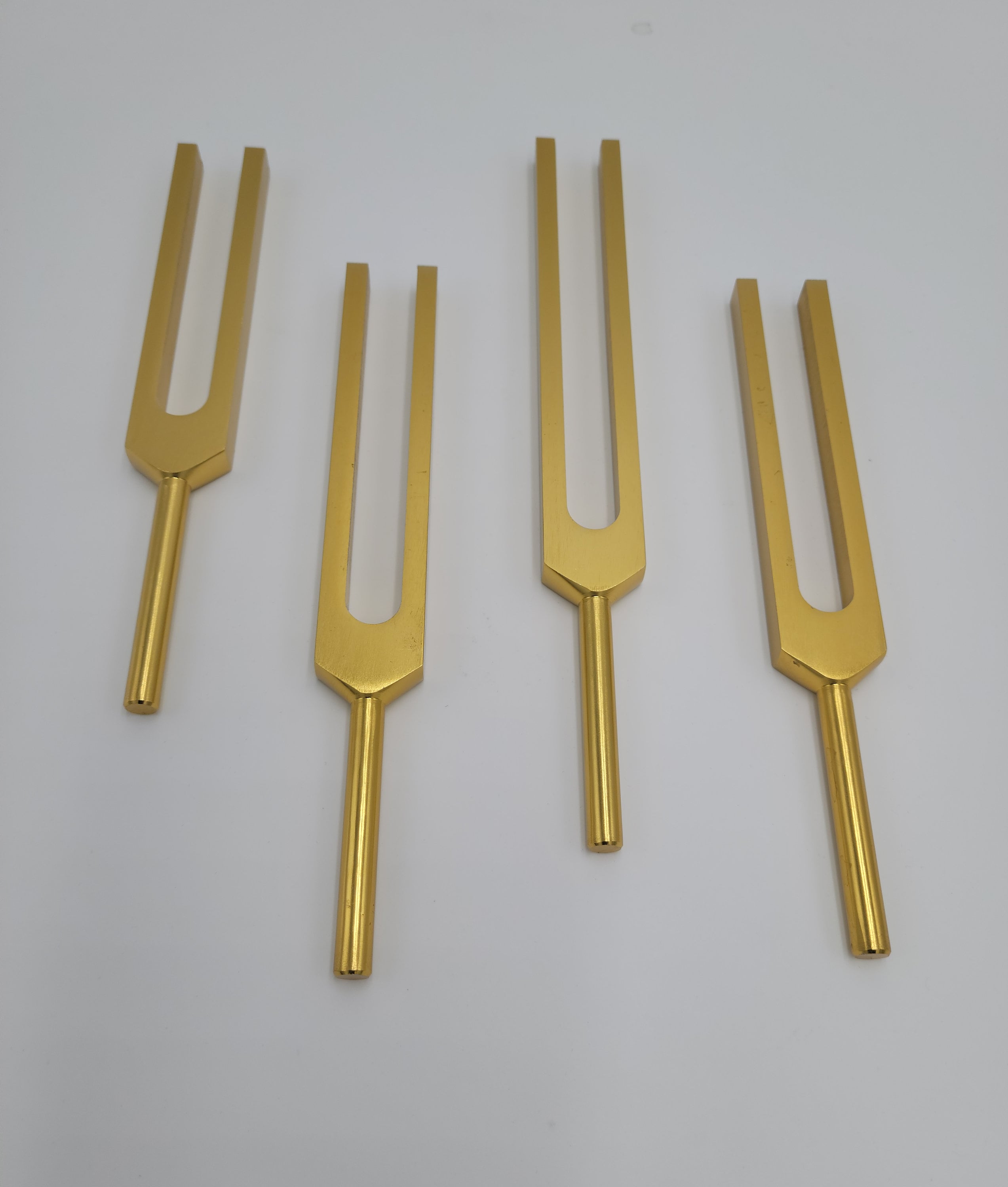 Gold Color Lemurian Tuning Forks Set of 4 with Mallets and Velvet Bag - Thecosmicaccess