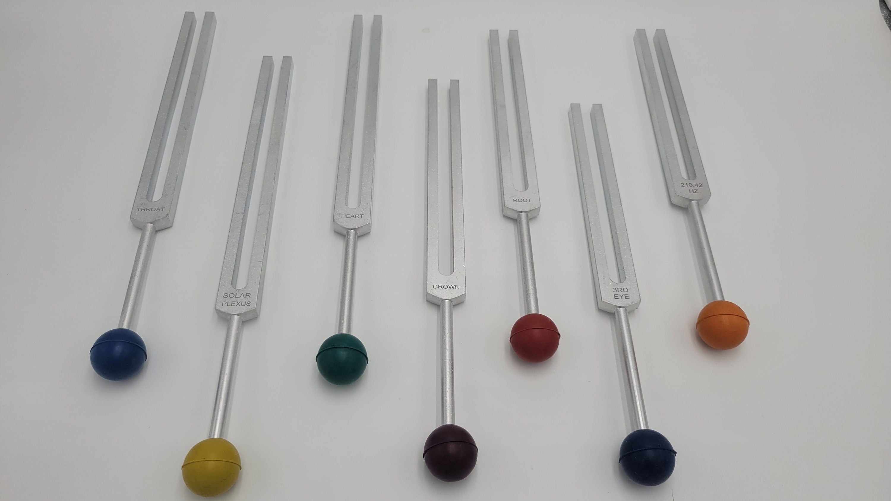 Chakra Tuning Forks Set of 7 with Long Handles Color Coded Removable Rubber Chakra Balls Pouch and 4 Mallets - Thecosmicaccess
