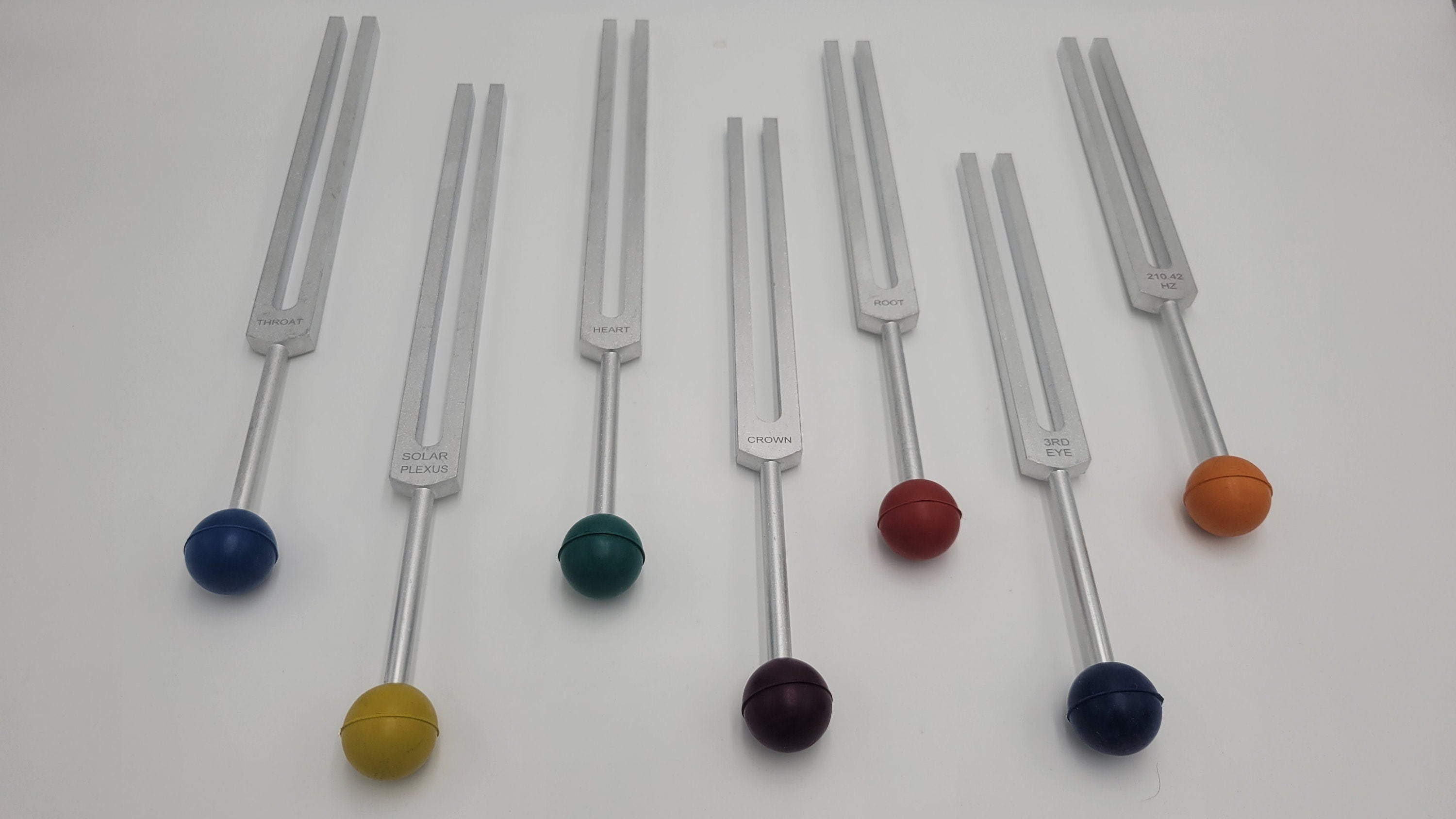 Chakra Tuning Forks Set of 7 with Long Handles Color Coded Removable Rubber Chakra Balls Pouch and 4 Mallets - Thecosmicaccess