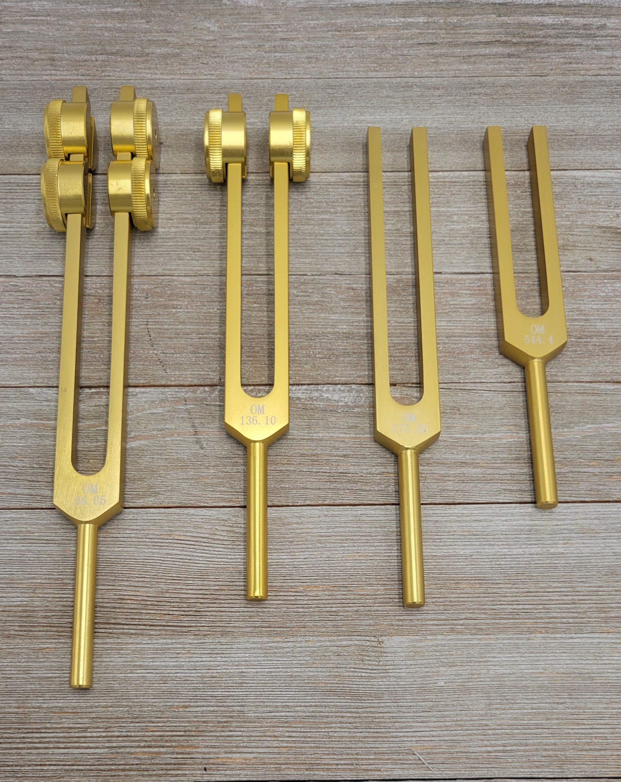 Gold Color Set of 4 Weighted Low Mid and Unweighted High OM OHM Tuning Forks with Mallet and Pouch - Thecosmicaccess
