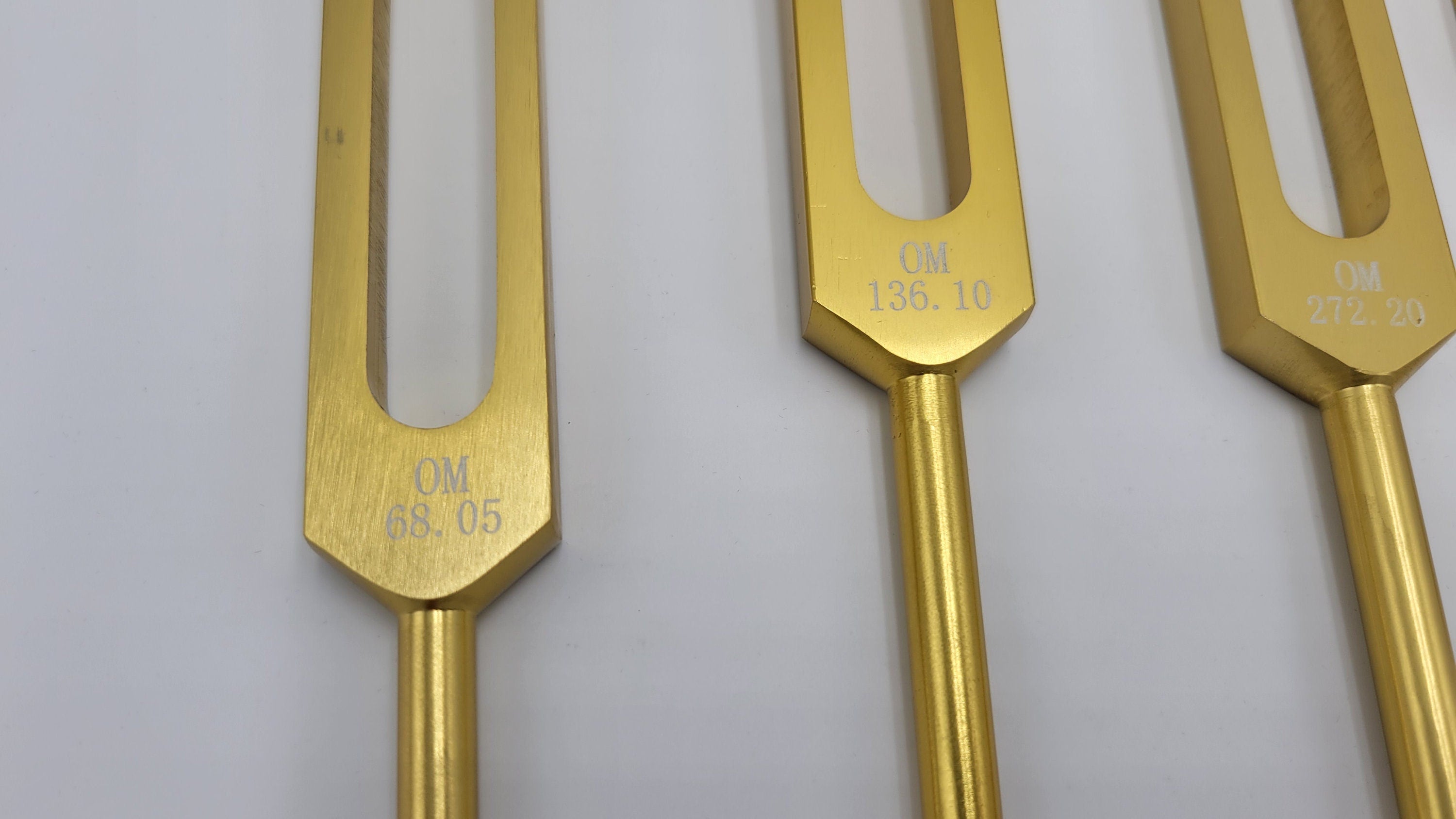 Gold Color Set of 4 Weighted Low Mid and Unweighted High OM OHM Tuning Forks with Mallet and Pouch - Thecosmicaccess