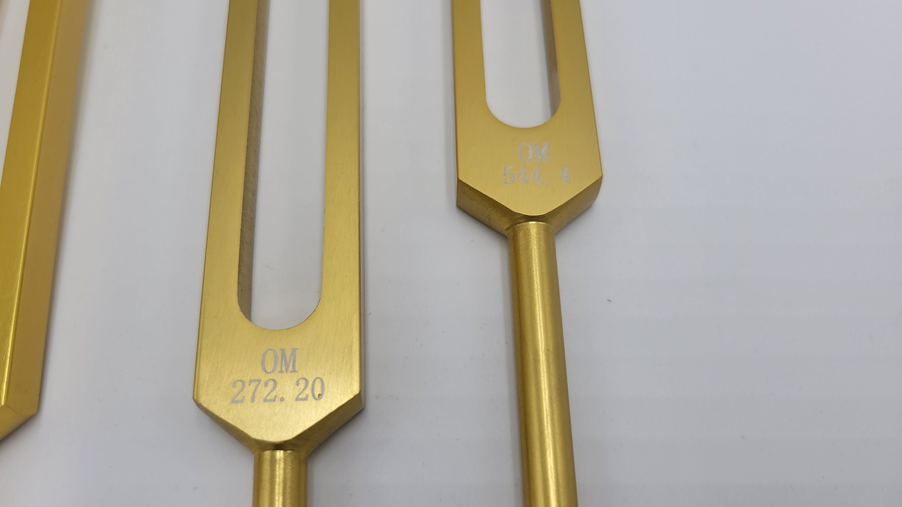 Gold Color Set of 4 Weighted Low Mid and Unweighted High OM OHM Tuning Forks with Mallet and Pouch - Thecosmicaccess