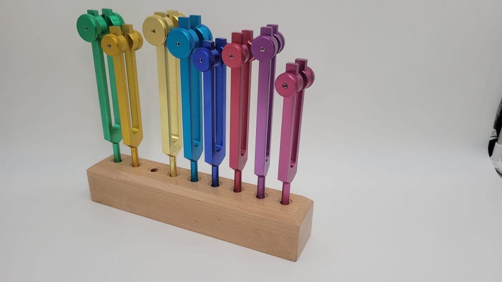 Chakra Set of 8 COLOR WEIGHTED Tuning forks with Solid Wood Tuning Forks Holder a Bag and 4 Strikers - Thecosmicaccess