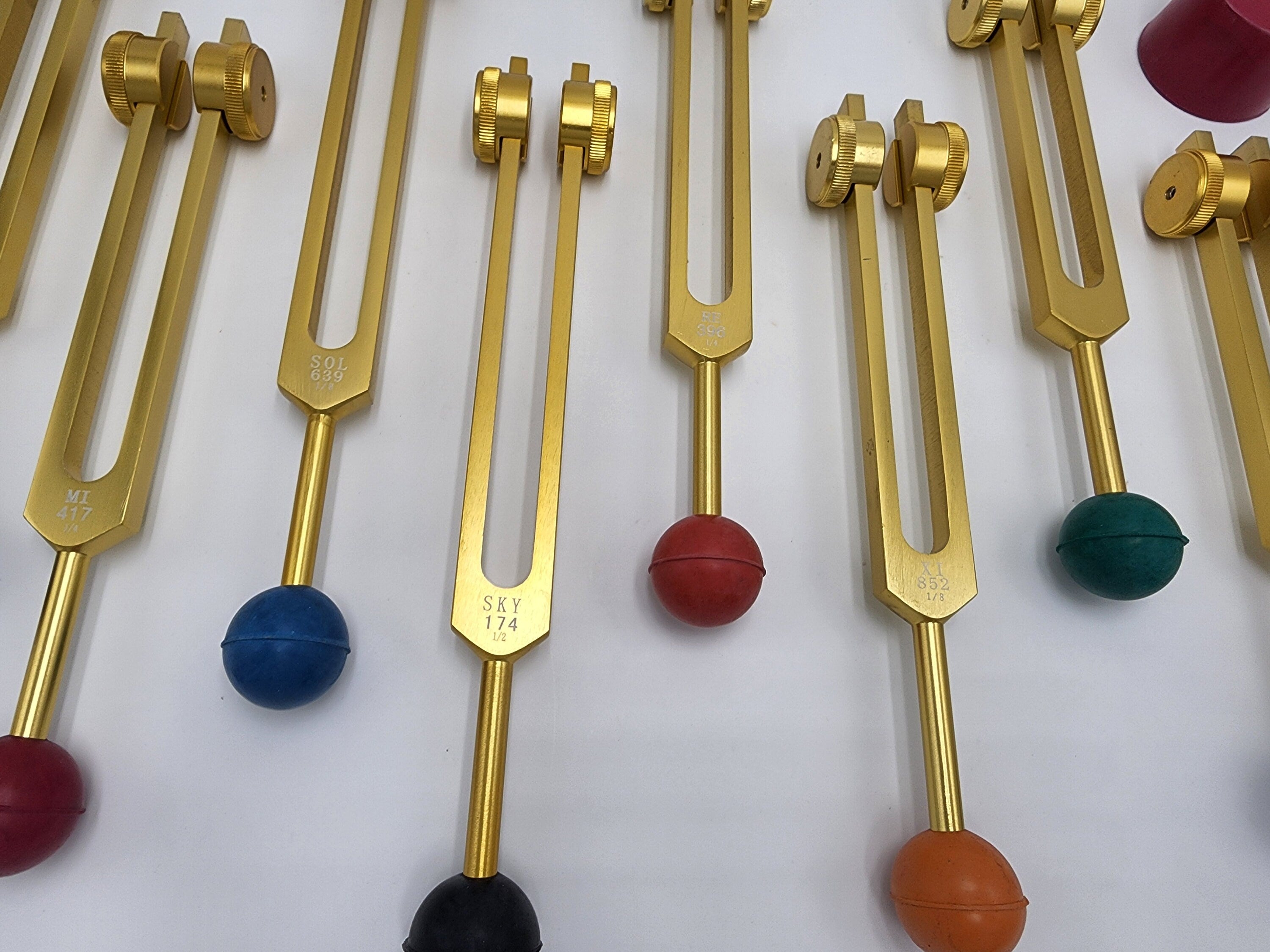 Gold Color DNA Repair Sacred Solfeggio Weighted Tuning Fork Set of 9 with Activator Rubber Balls and Velvet Bag - Thecosmicaccess