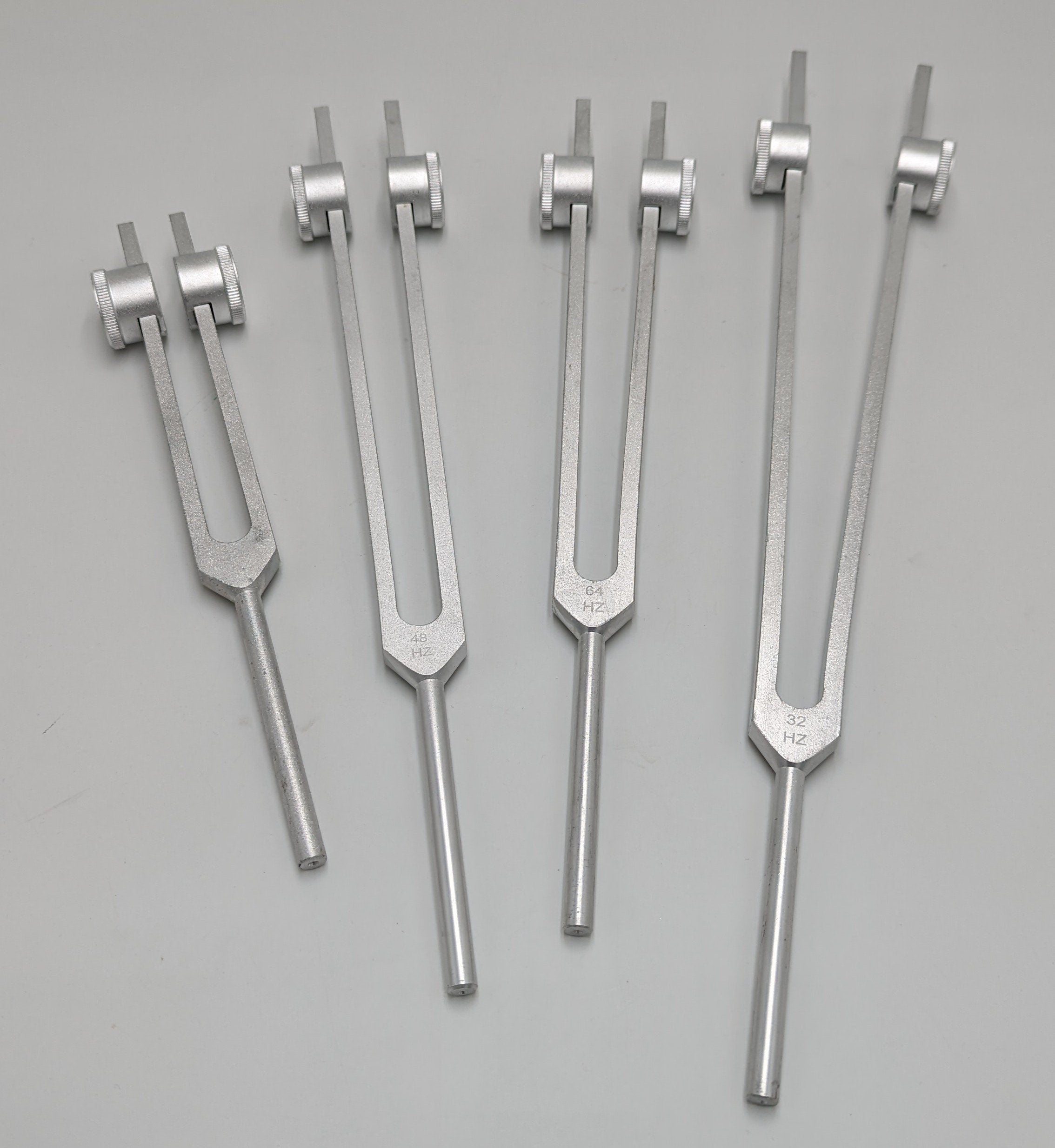 Professional Otto Tuners Weighted 4 Tuning Forks 32 Hz 48 Hz 64 Hz and 128 Hz with Velvet Bag and Striker - Thecosmicaccess