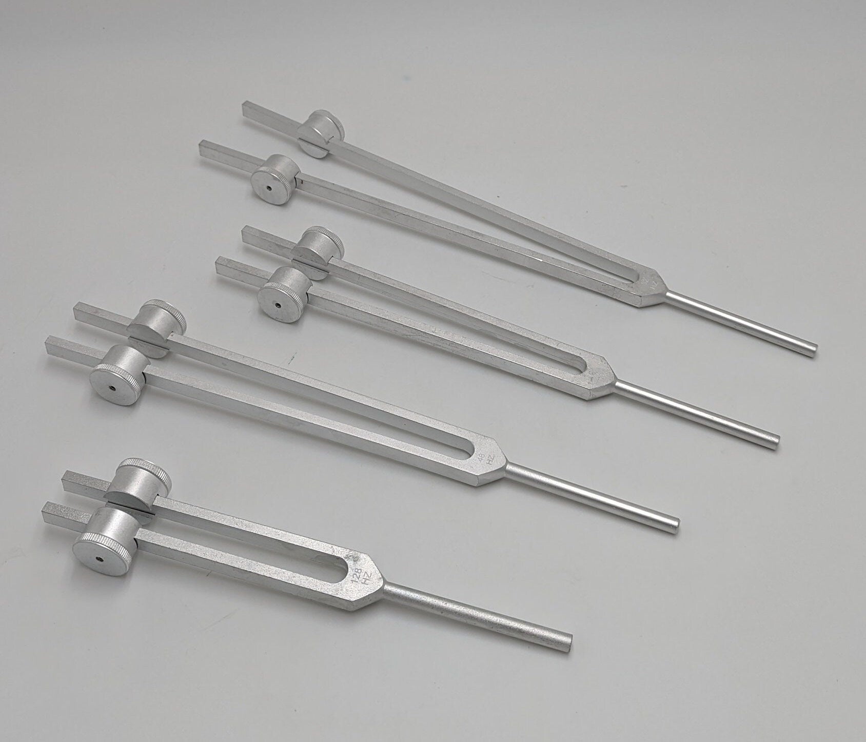 Professional Otto Tuners Weighted 4 Tuning Forks 32 Hz 48 Hz 64 Hz and 128 Hz with Velvet Bag and Striker - Thecosmicaccess