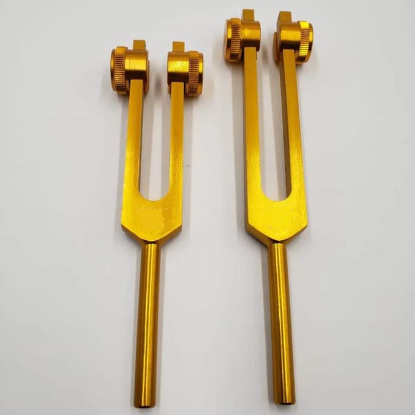 A Pair of Schumann Frequency Weighted Gold Color Tuning Forks