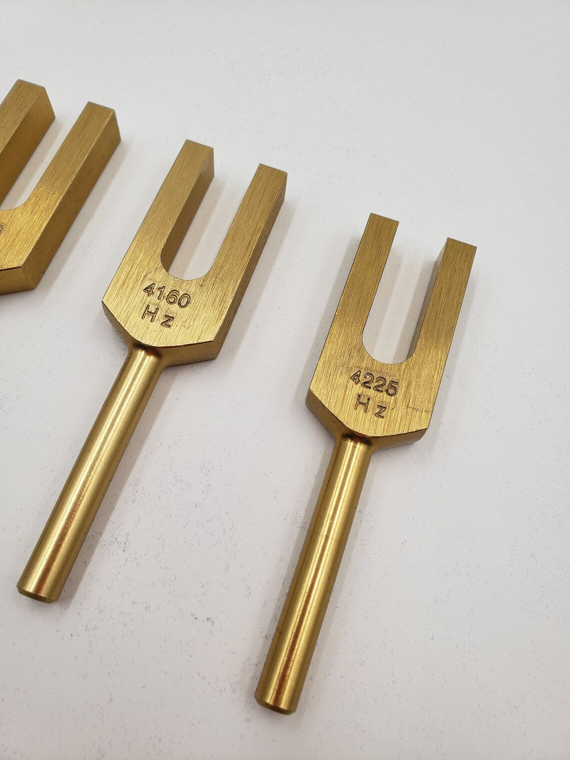 Celestial Harmony: Gold Finish Angel Tuning Fork Set for Healing Sound Therapy - Includes 4096, 4160, and 4225 Hz Tuners, Mallet, and Pouch