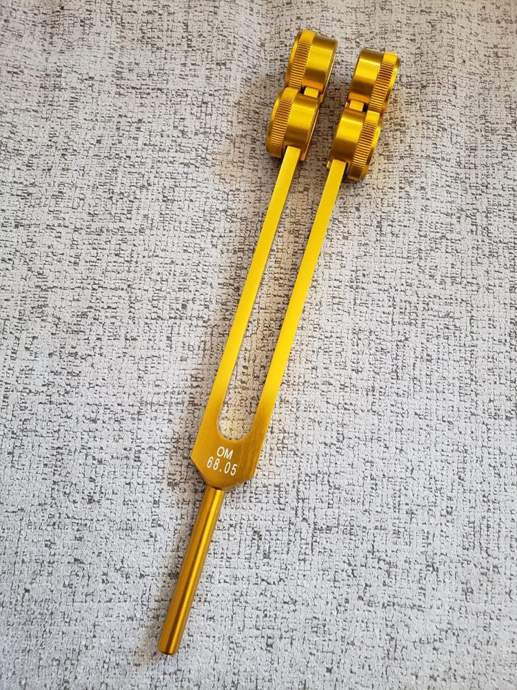 Low Om 68.05 Gold Color 9th Chakra Hz Weighted Tuning Fork with Mallet and Velvet Bag - Thecosmicaccess