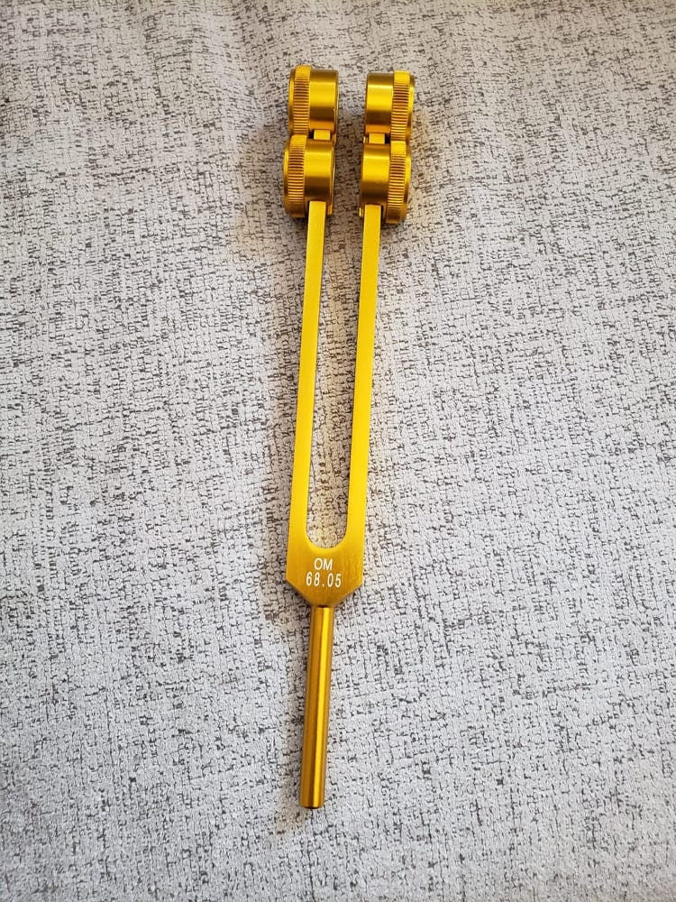 Low Om 68.05 Gold Color 9th Chakra Hz Weighted Tuning Fork with Mallet and Velvet Bag - Thecosmicaccess