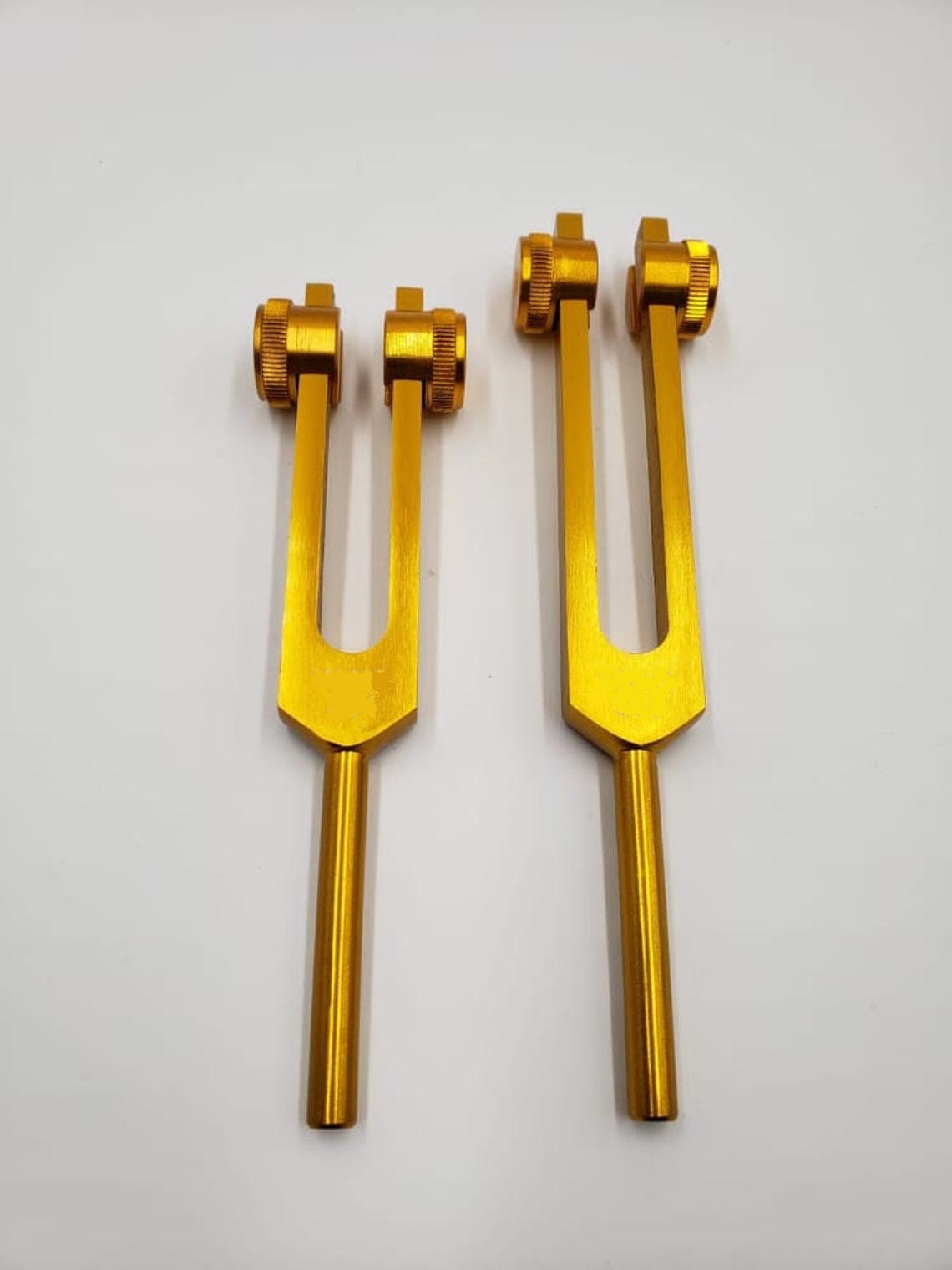 A Pair of Schumann Frequency Weighted Gold Color Tuning Forks - Thecosmicaccess