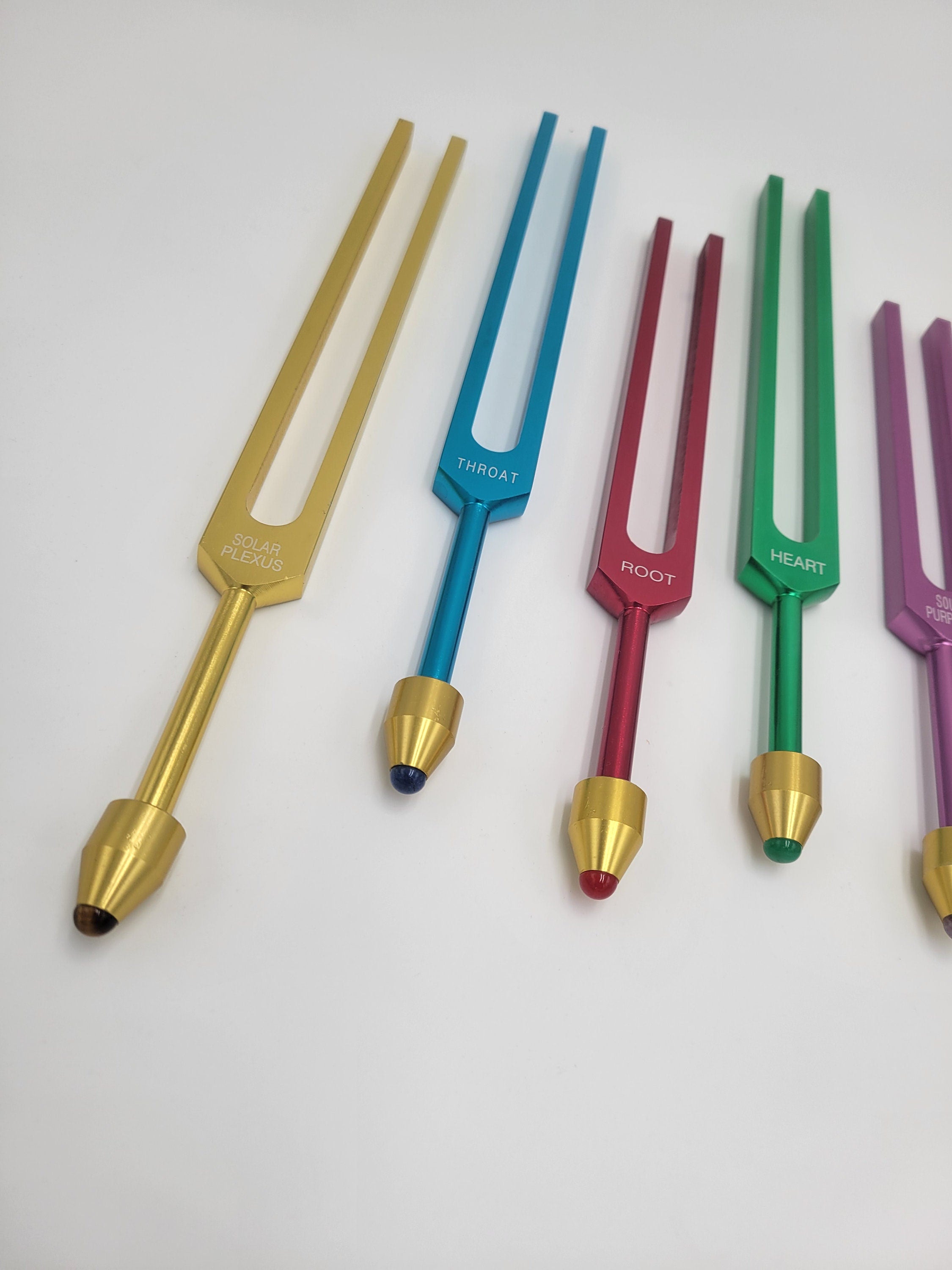 The Holistic Chakra Color Unweighted Tuning Fork Set with 8 GEM FEET on each Fork with 8 Mallets and Chakra Marked Drawstring Pouches - Thecosmicaccess